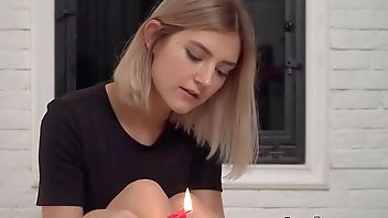 Cute teen with big natural tits plays with wax and pussy