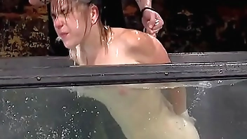 Brunette slave punished in water bondage