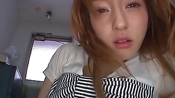 Asian cutie in high heels keeps a toy in her jeans