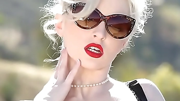 Two sexy blonde models get naked in front of the camera