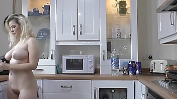 Hot blonde with big tits and sexy ass making coffee naked