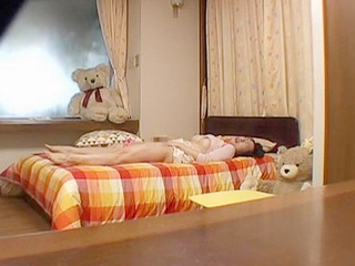 Naughty Japanese girl gets caught in the act of masturbating on hidden cam for some hot XXX action.